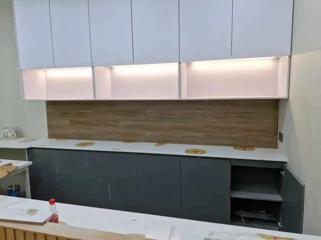 Kitchen cabinet woodwork built by AEC's carpentry contractor team in Karachi